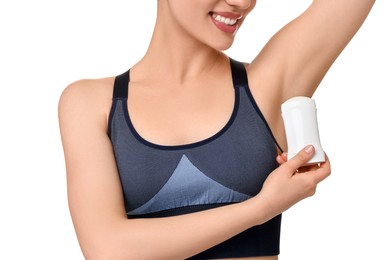 Woman applying deodorant on white background, closeup