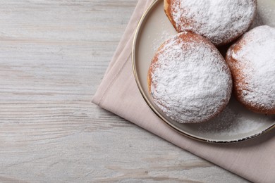 Photo of Delicious sweet buns on wooden table, top view. Space for text