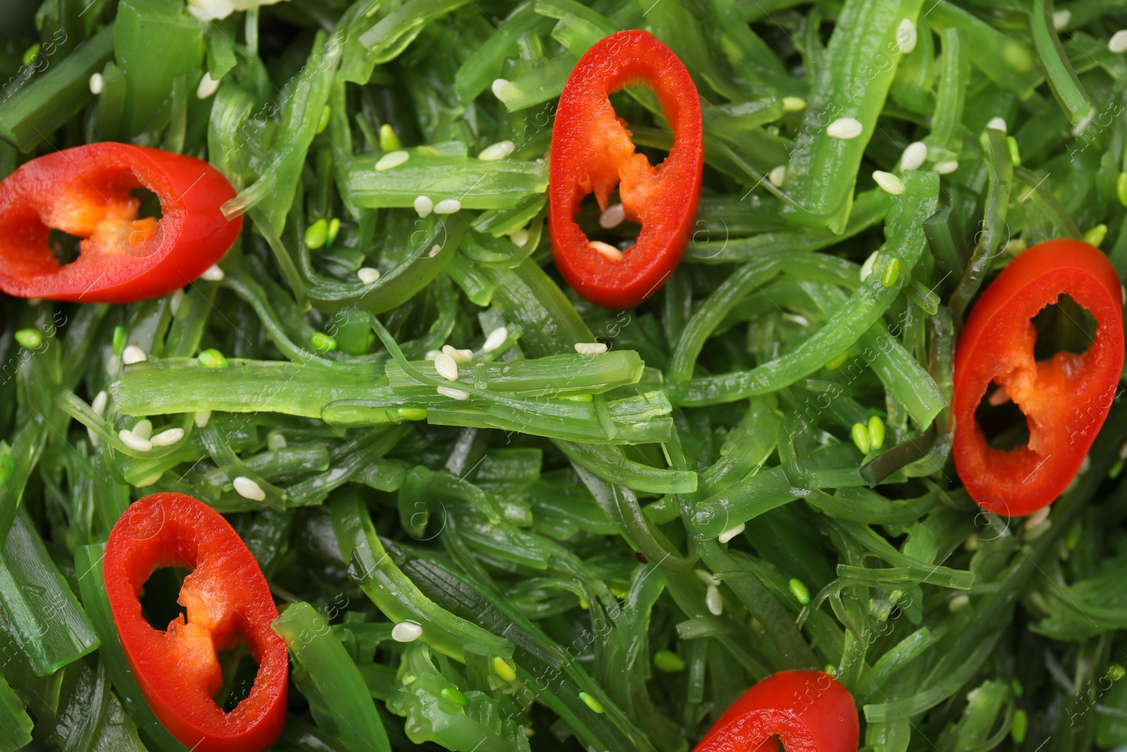 Photo of Tasty seaweed salad as background, top view