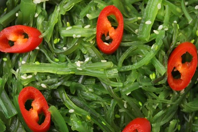 Photo of Tasty seaweed salad as background, top view