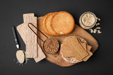 Rye crispbreads, rice cakes and rusks on table, flat lay