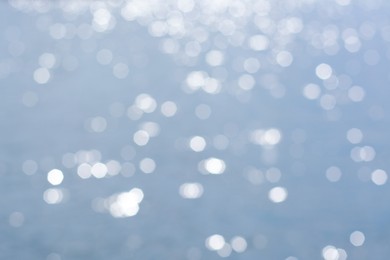Photo of Blurred view of seascape on sunny day, bokeh effect