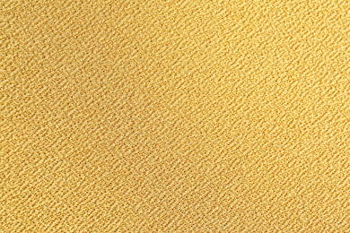 Photo of Texture of beautiful yellow fabric as background, closeup