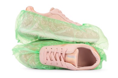 Photo of Sneakers in green shoe covers isolated on white