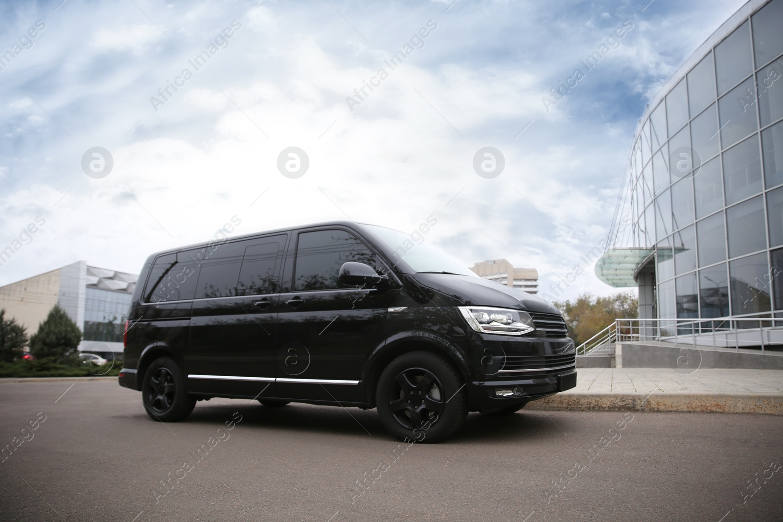 Photo of Black delivery van parked on street near building