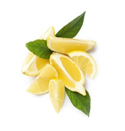 Photo of Fresh ripe lemon slices with leaves on white background, top view