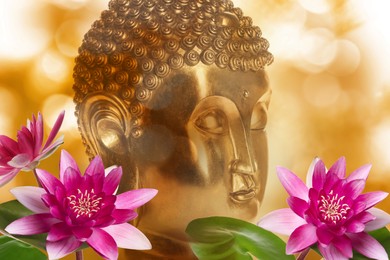 Image of Beautiful golden Buddha sculpture and lotus flowers on color background