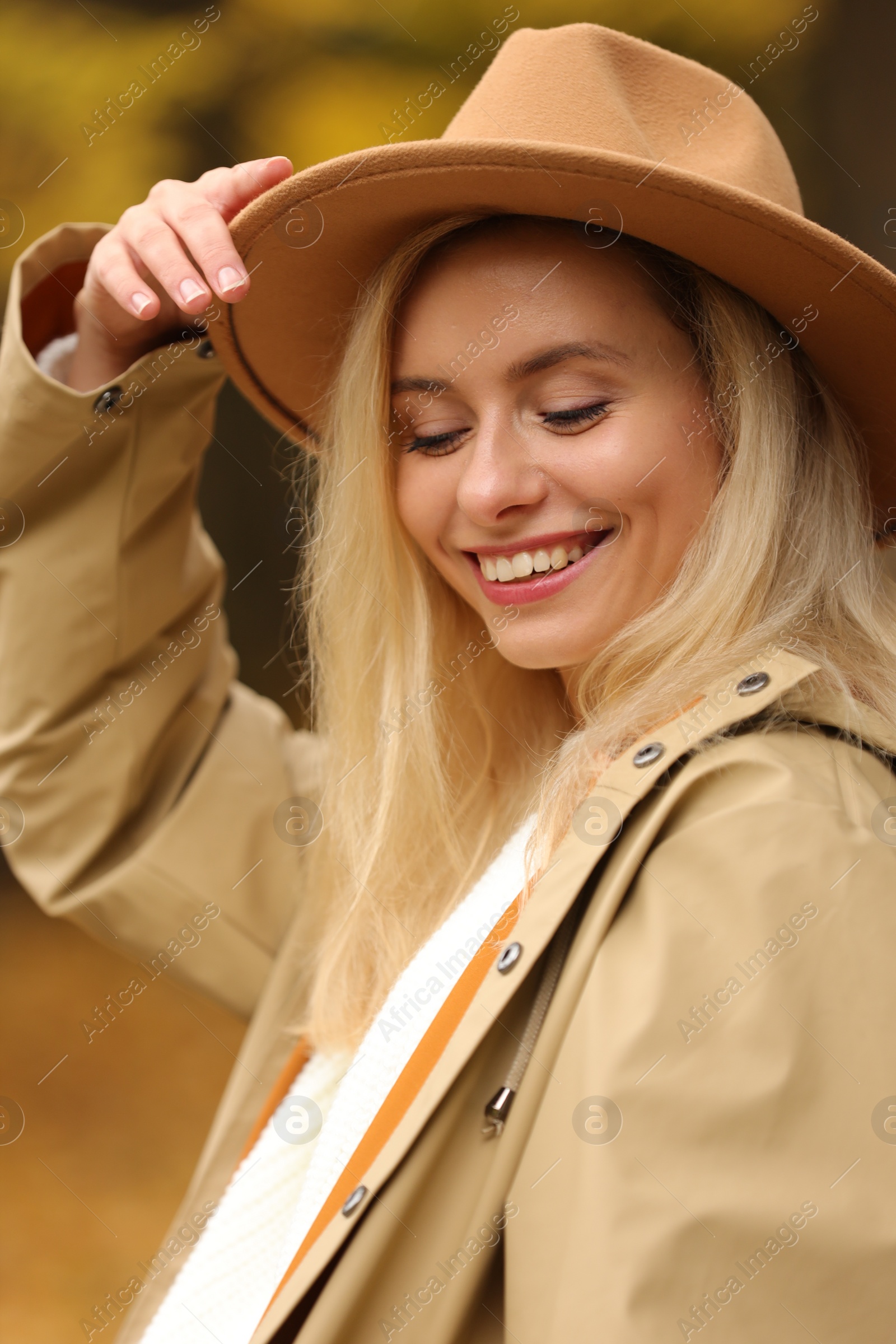 Photo of Autumn vibes. Portrait of happy woman outdoors