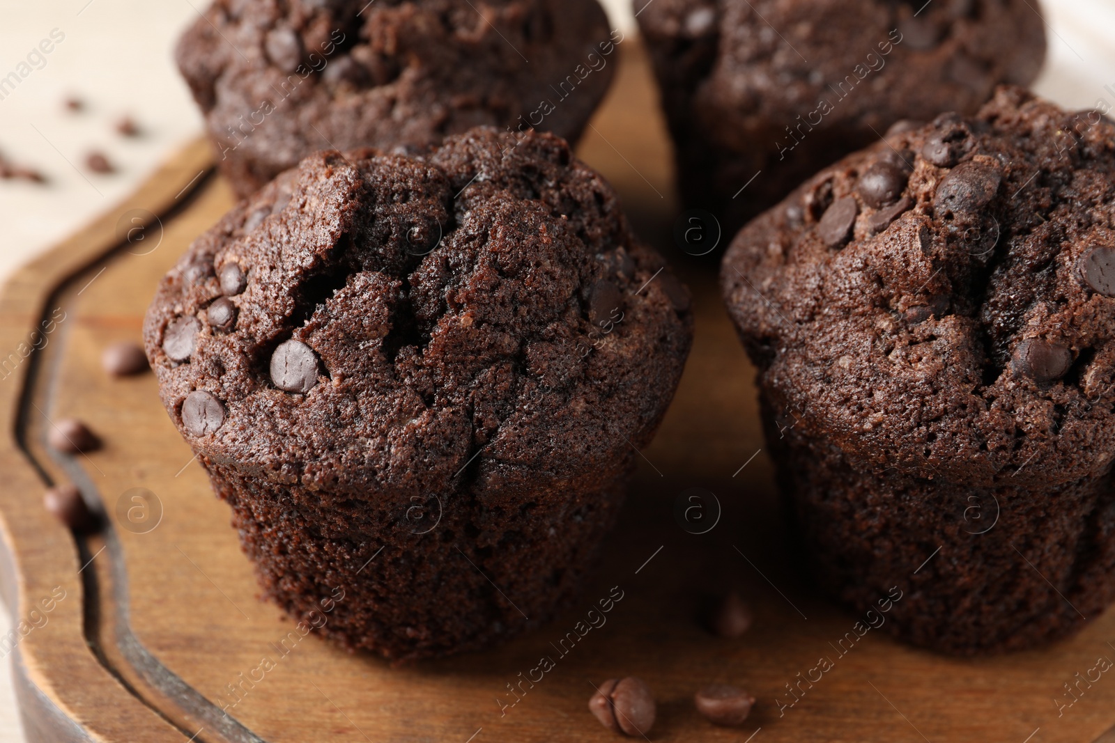 Photo of Delicious fresh chocolate muffins on table, closeup