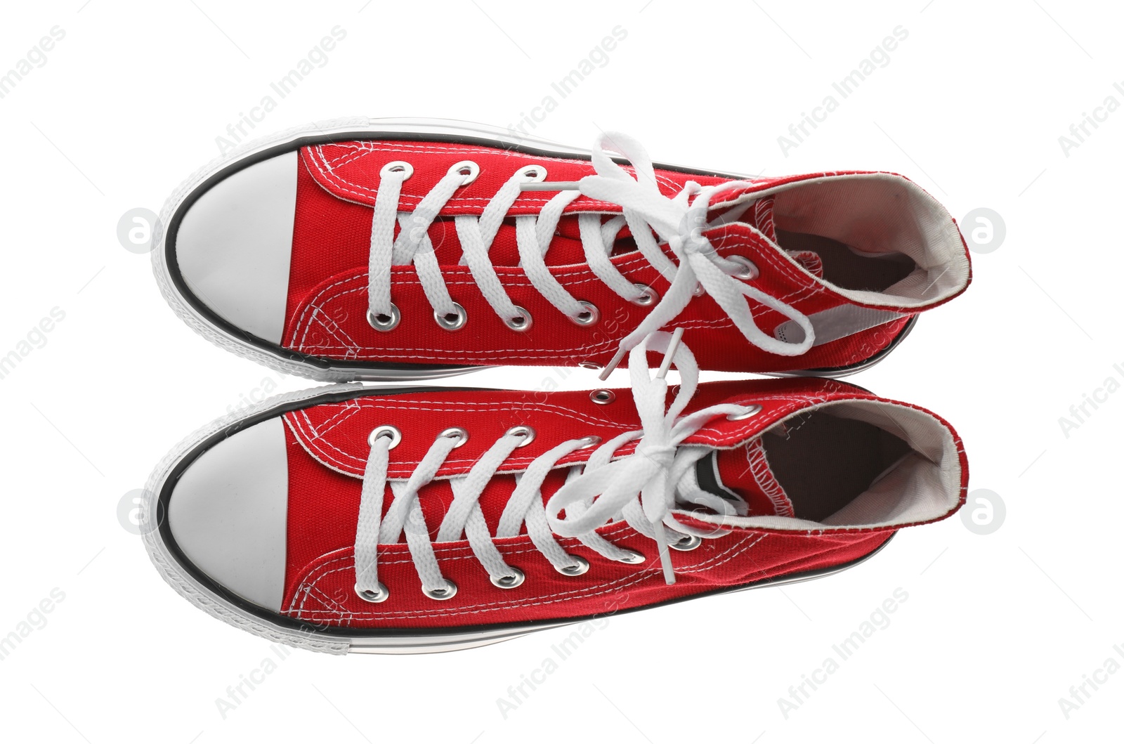 Photo of Pair of trendy sneakers isolated on white, top view