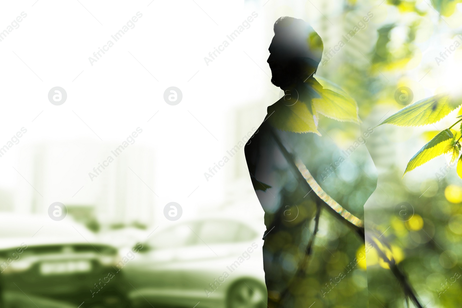 Image of Double exposure of man and green leaves on city street