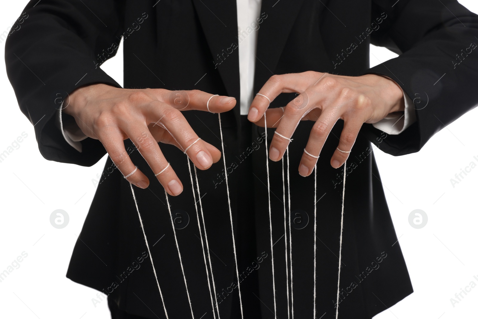 Photo of Woman in suit pulling strings of puppet on white background, closeup