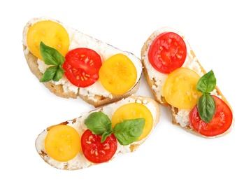 Photo of Tasty fresh tomato bruschettas on white background, top view