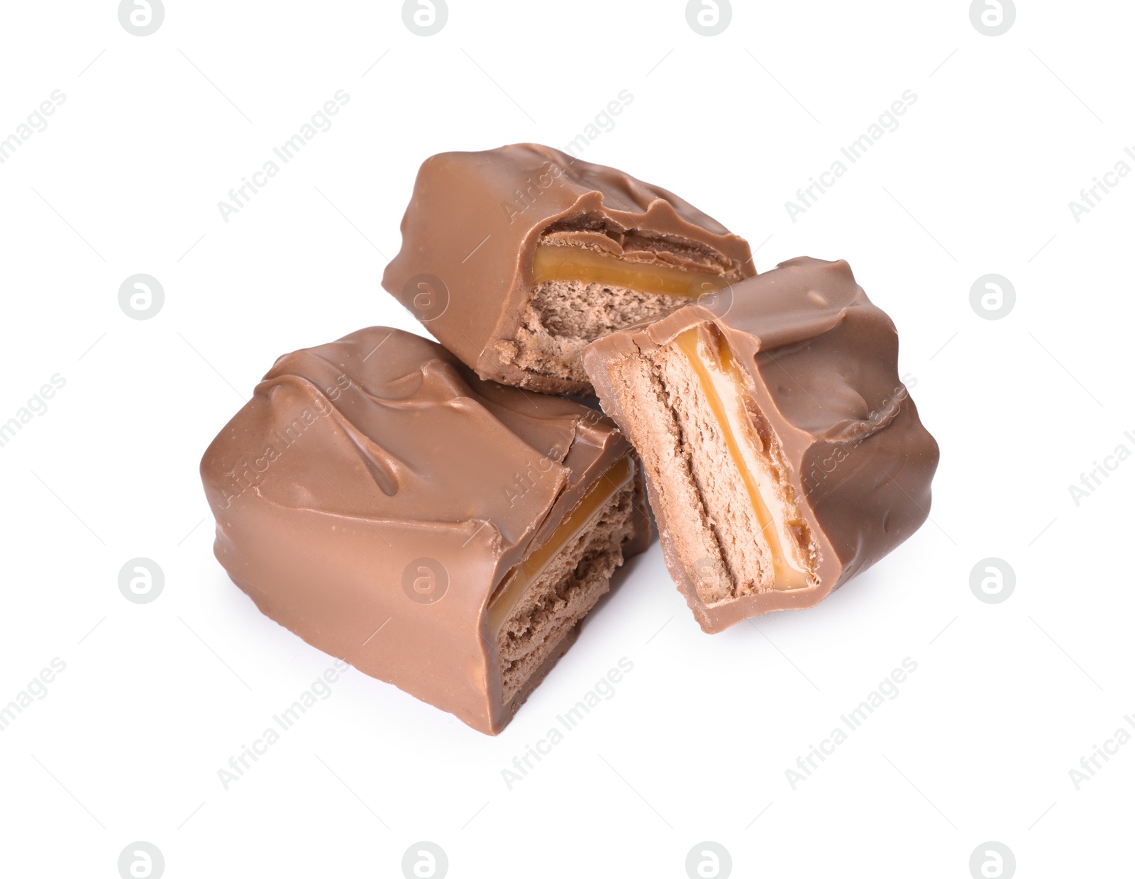 Photo of Pieces of tasty chocolate bars with nougat on white background