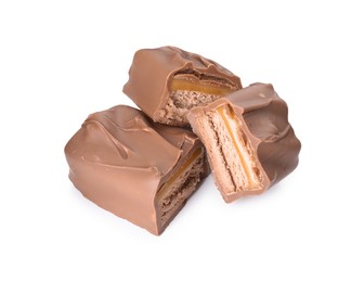 Pieces of tasty chocolate bars with nougat on white background