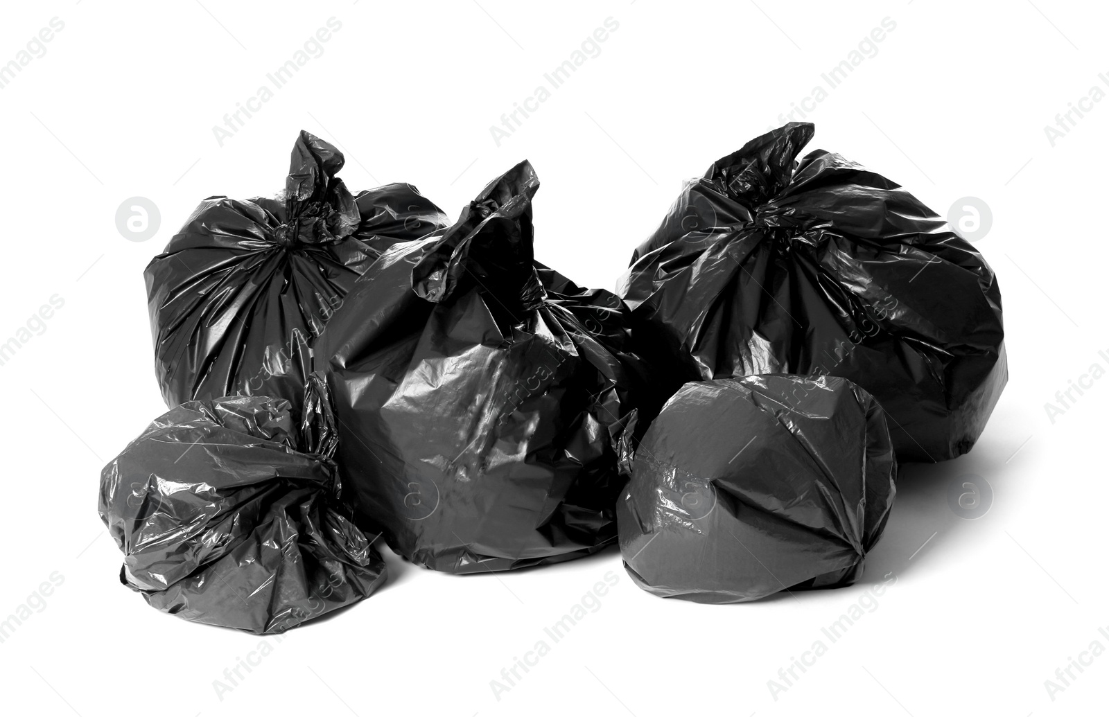 Photo of Trash bags full of garbage isolated on white