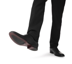 Photo of Businessman in leather shoes on white background, closeup