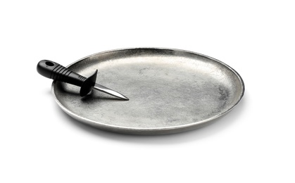 Photo of Stainless steel oyster knife with plastic handle on metal tray against white background