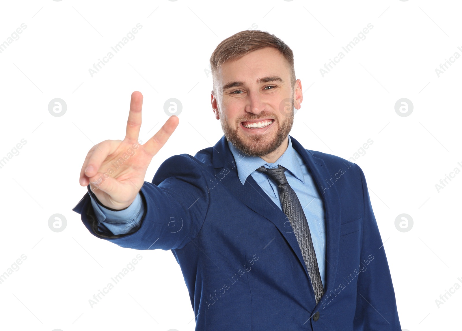 Photo of Young businessman celebrating victory on white background