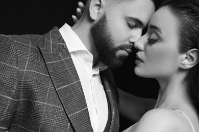 Image of Handsome bearded man with his sexy lady, toned in black and white