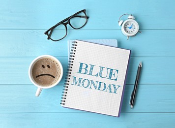 Image of Blue Monday. Flat lay composition with office stationery and cup of coffee on wooden table