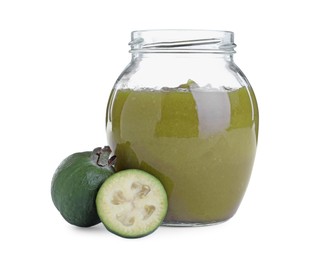 Photo of Feijoa jam in glass jar and fresh fruits on white background