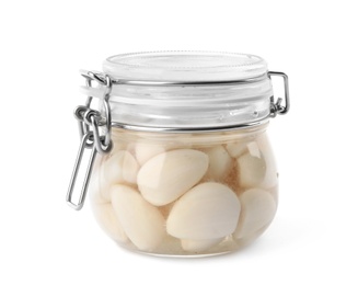 Photo of Jar with pickled garlic on white background