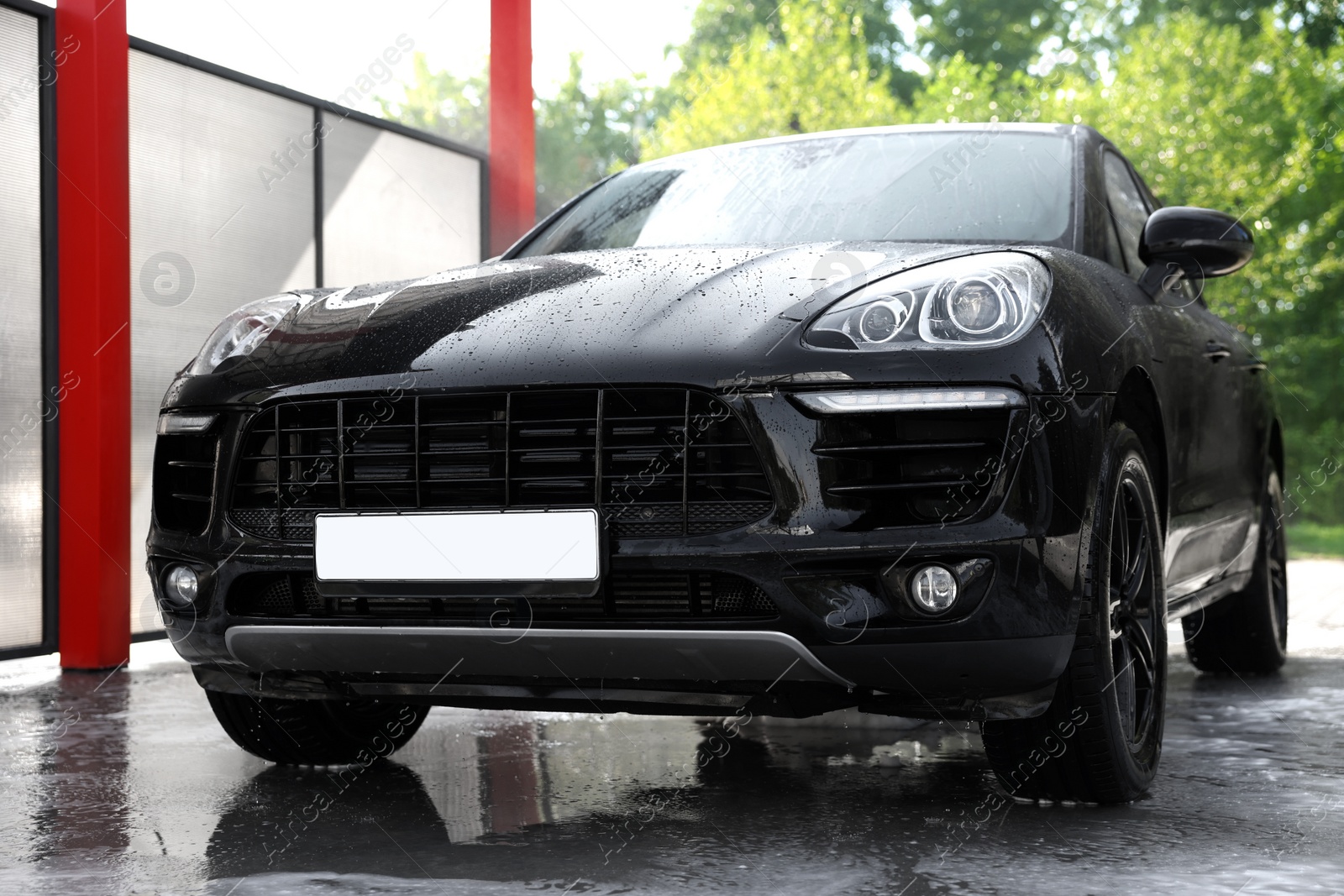 Photo of Clean auto after washing at outdoor car wash