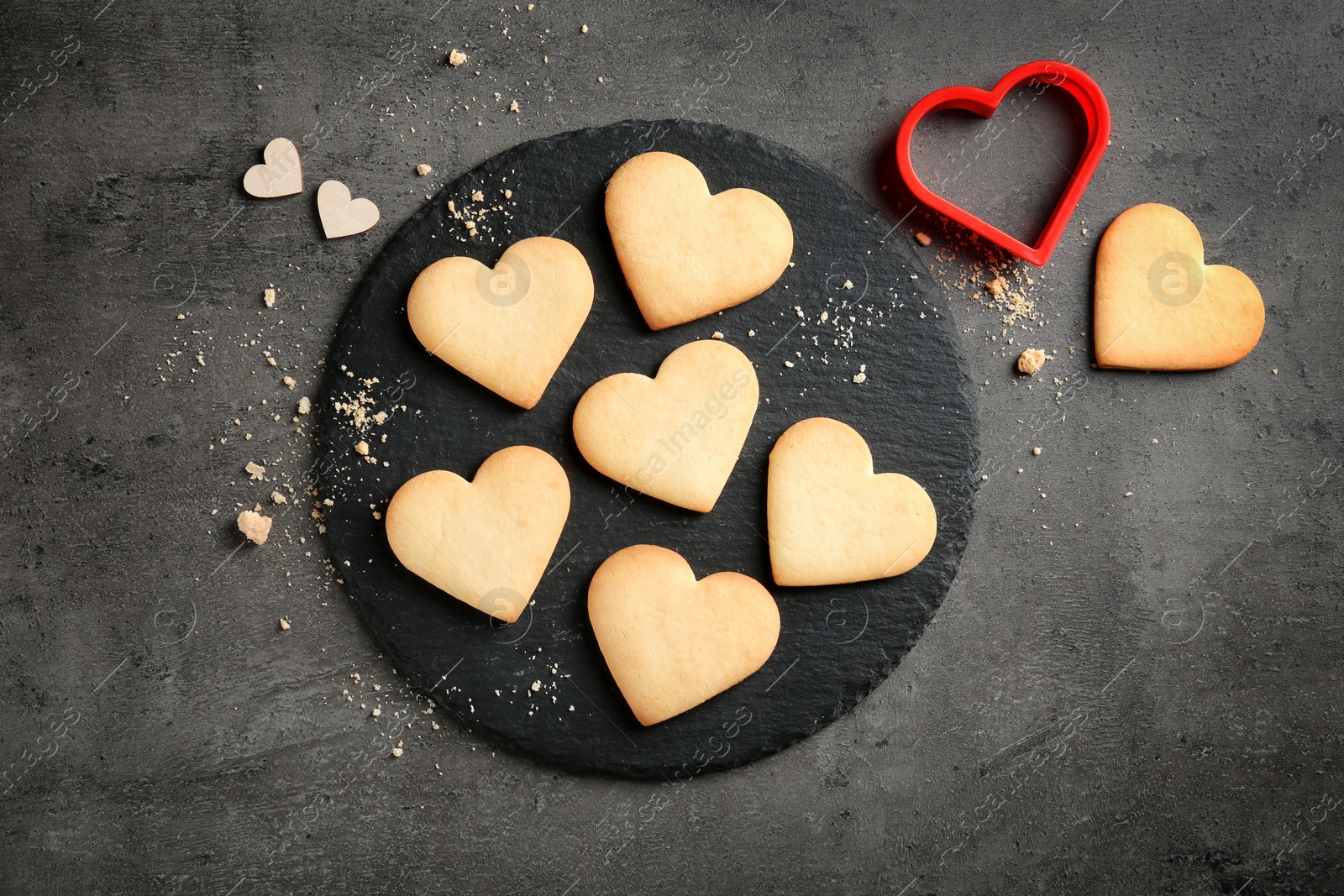 Photo of Flat lay composition with homemade heart shaped cookies on table