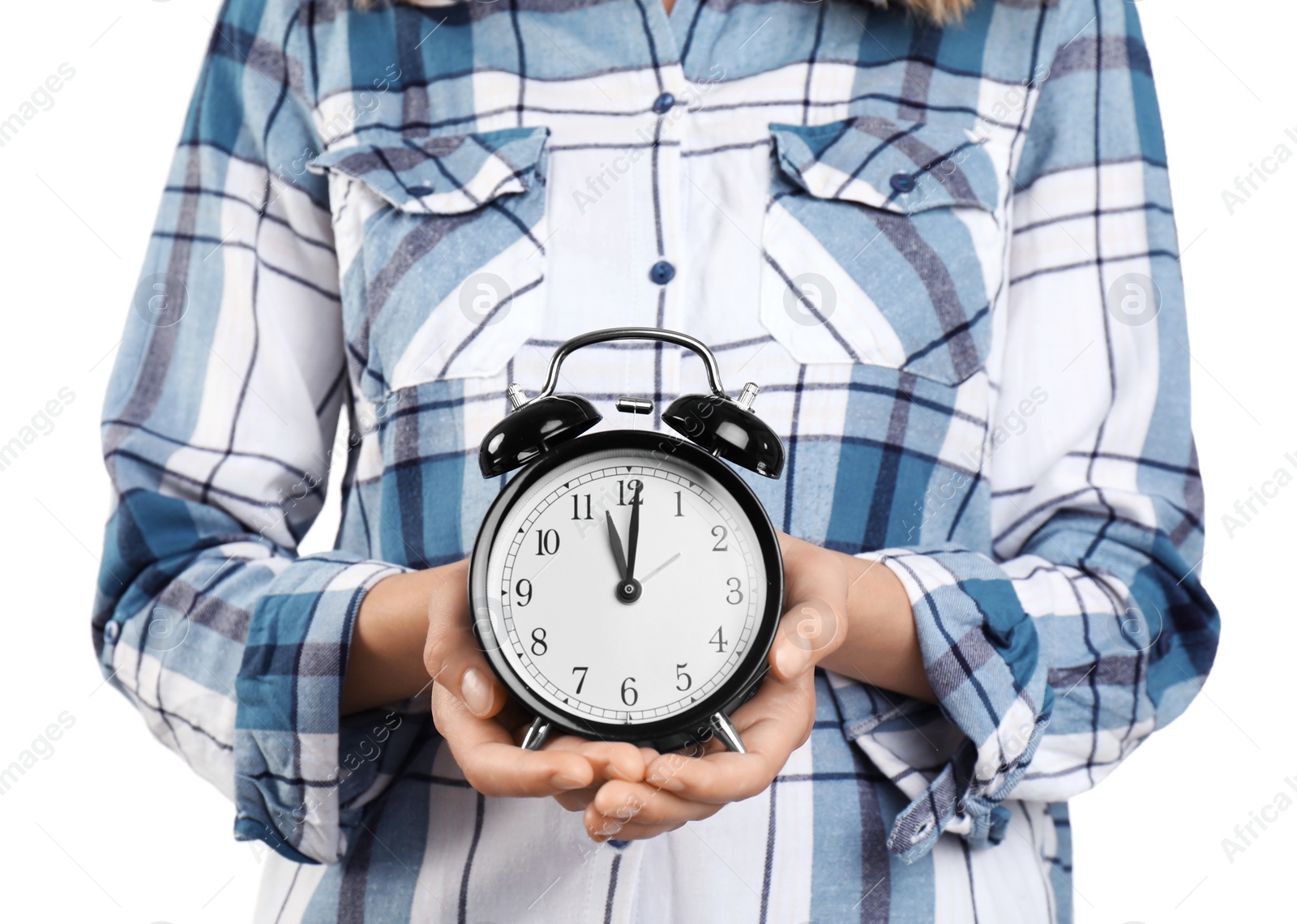 Photo of Young woman holding clock on white background. Time management