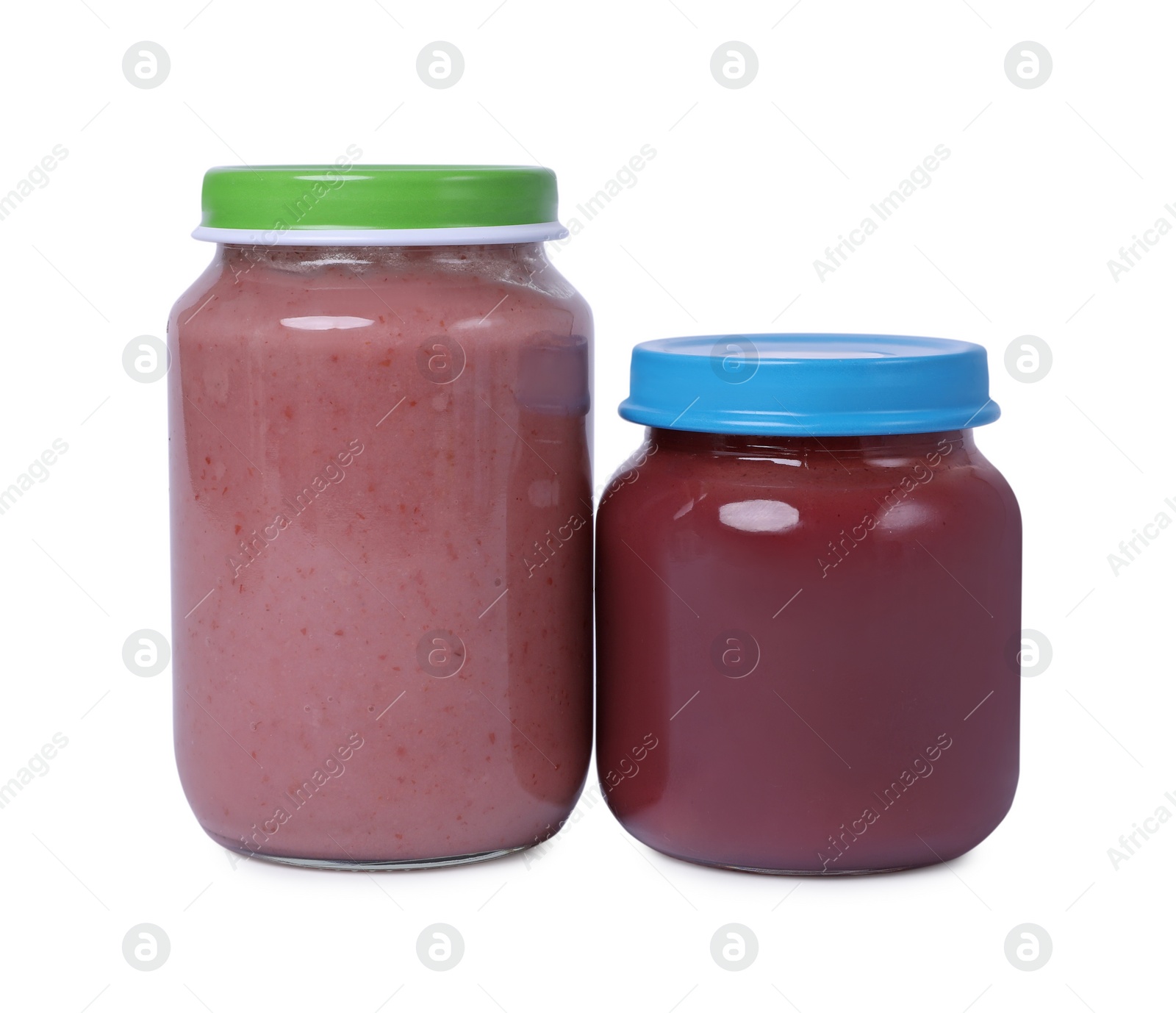 Photo of Glass jars with healthy baby food isolated on white