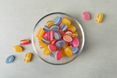 Tasty sweets on light grey table, flat lay