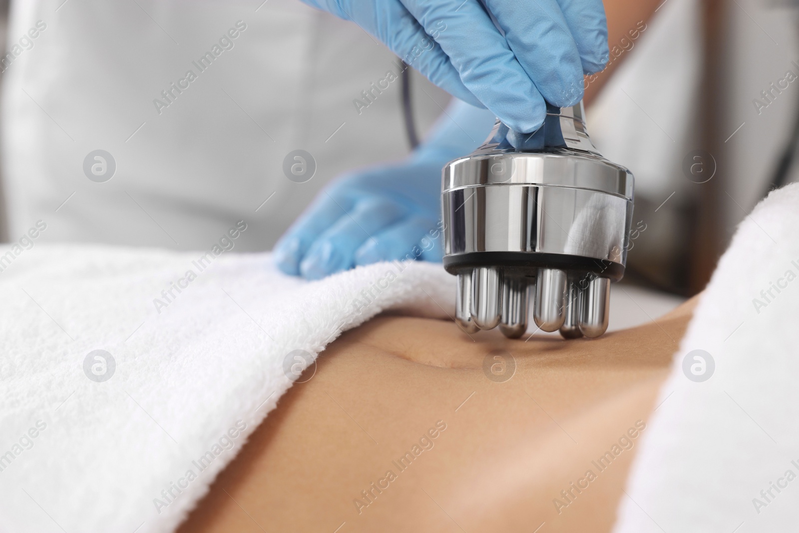 Photo of Woman undergoing radio frequency lifting procedure in beauty salon, closeup