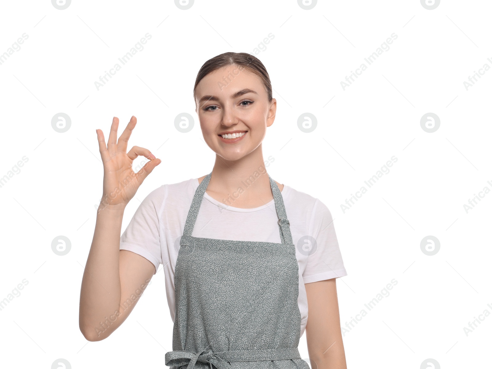 Photo of Beautiful young woman in clean apron on white background