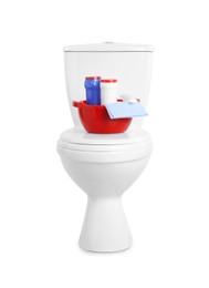 Photo of Toilet bowl and cleaning supplies on white background