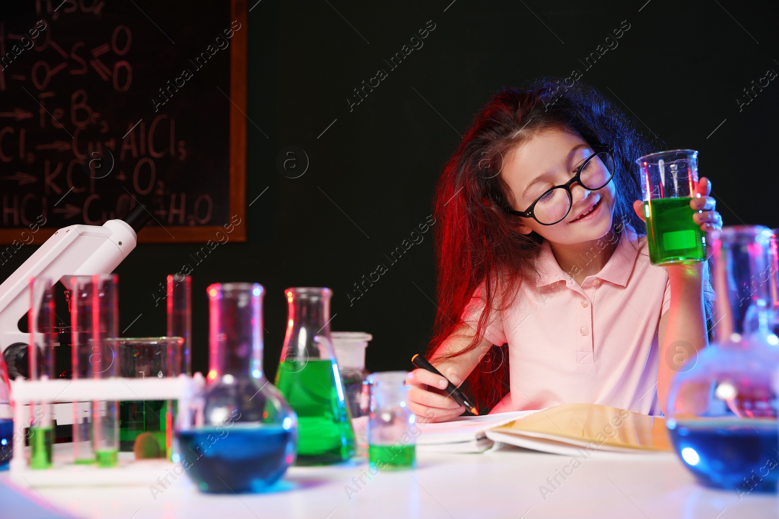 Photo of Child doing chemical research in laboratory, space for text. Dangerous experiment