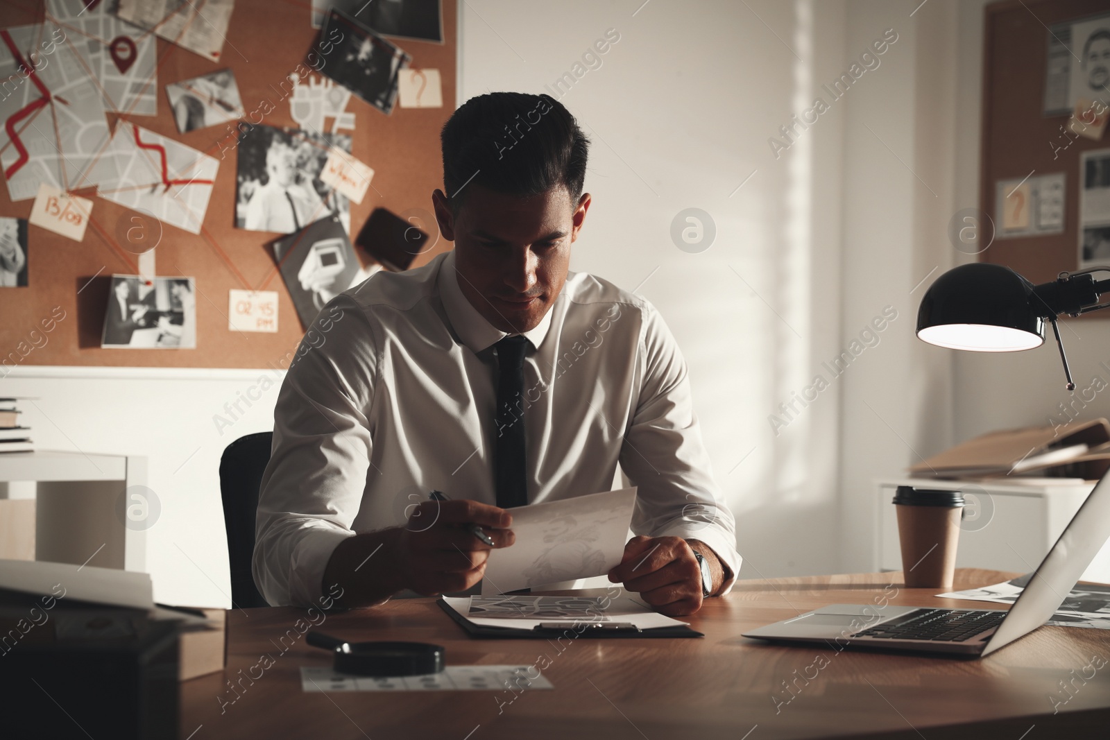 Photo of Detective working at desk in his office