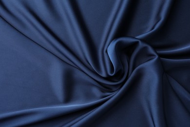 Texture of blue crumpled silk fabric as background, top view