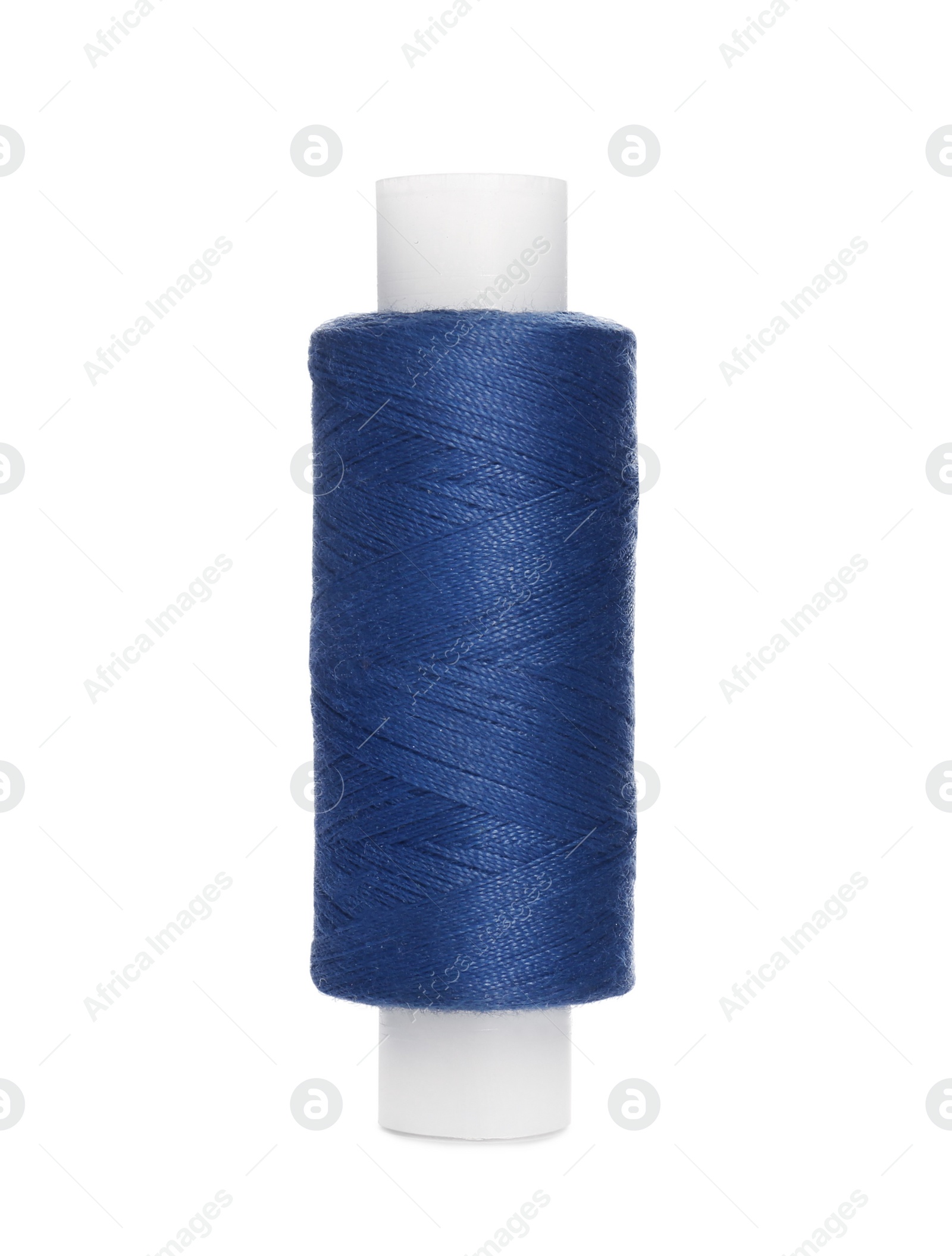 Photo of Spool of dark blue sewing thread isolated on white