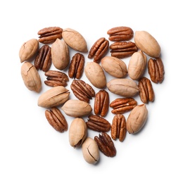 Heart shape made of pecan nuts on white background, top view
