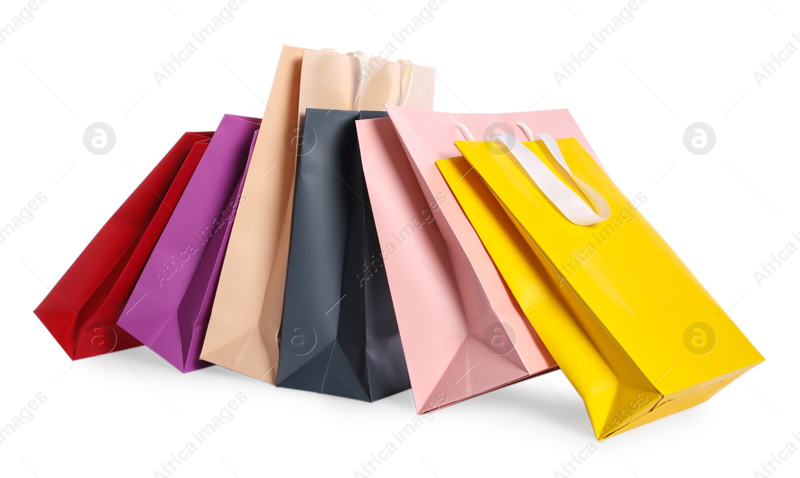 Photo of Colorful paper shopping bags isolated on white