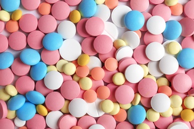 Photo of Many colorful pills as background