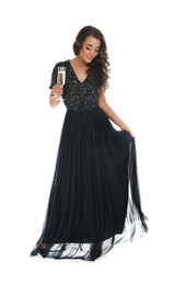 Beautiful young woman holding glass of champagne on white background. Christmas party