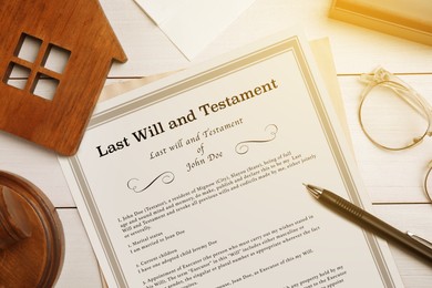 Image of Last Will and Testament, house model, glasses and pen on white wooden table, flat lay