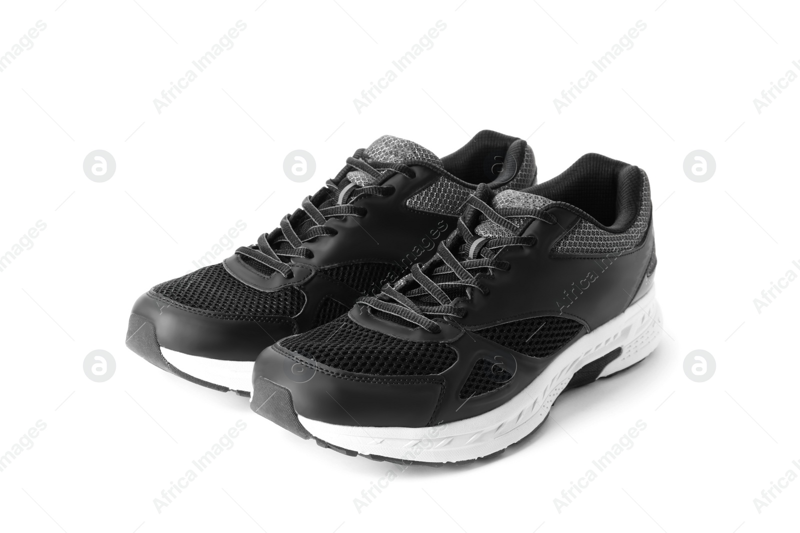 Photo of Stylish sport shoes on white background. Trendy footwear