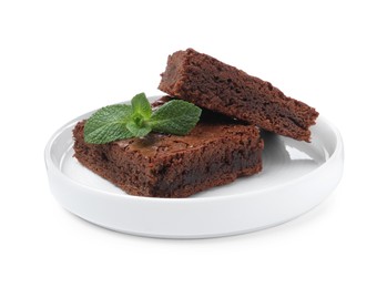 Delicious chocolate brownies with fresh mint leaves on white background