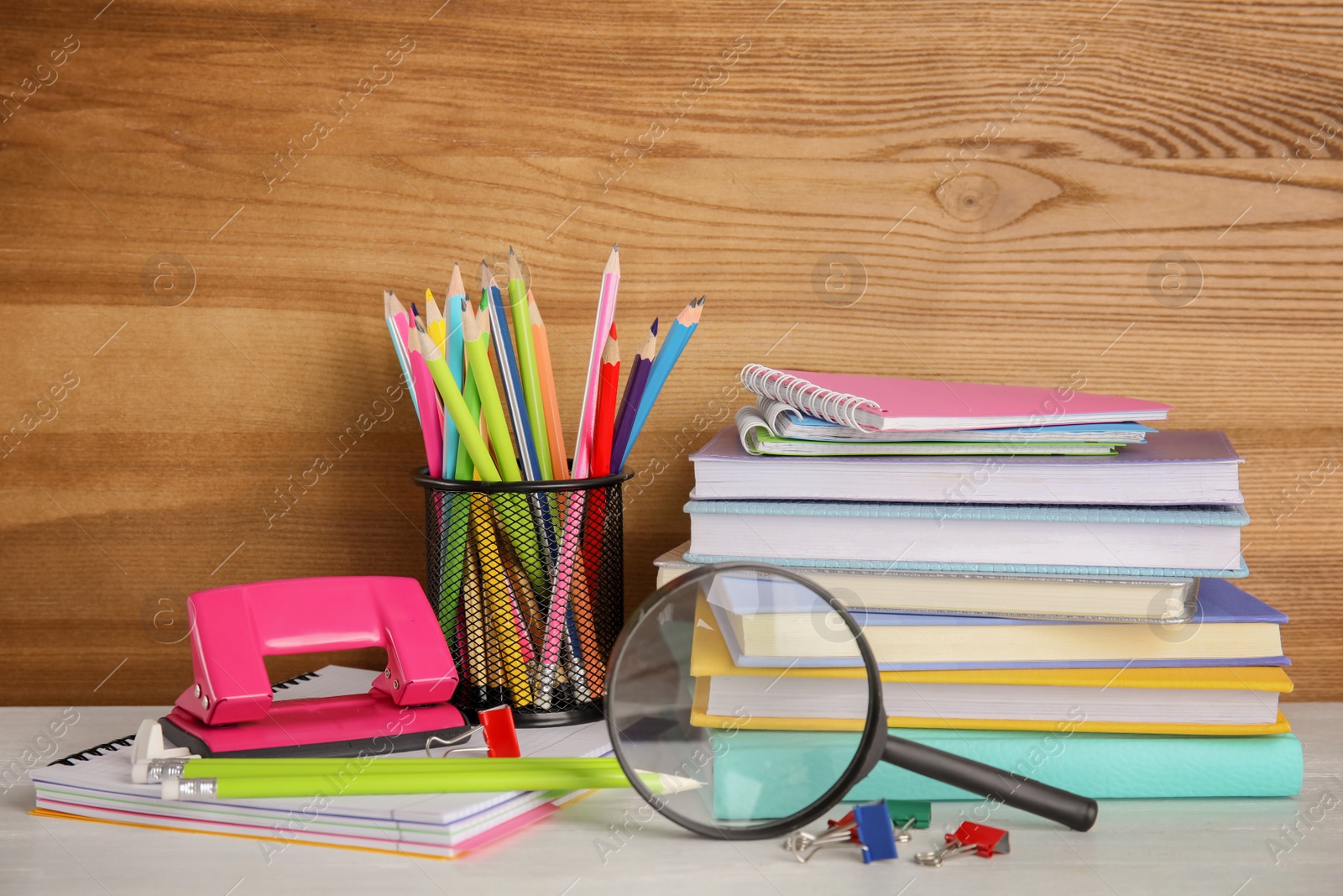 Photo of Different stationery on wooden table. Back to school