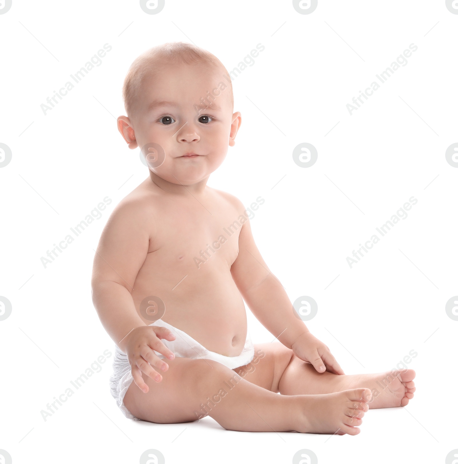 Photo of Cute little baby sitting on white background