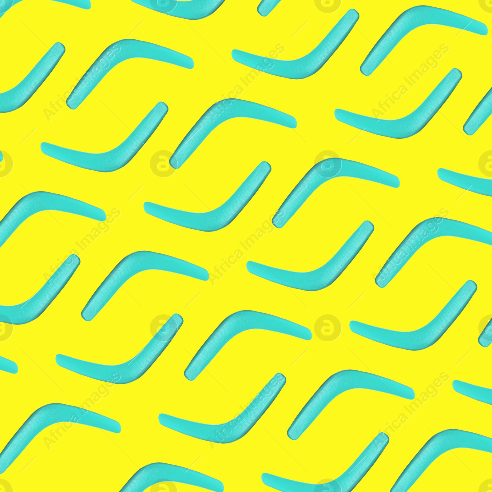 Image of Turquoise boomerangs on yellow background, flat lay