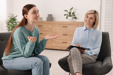 Professional psychotherapist working with patient in office